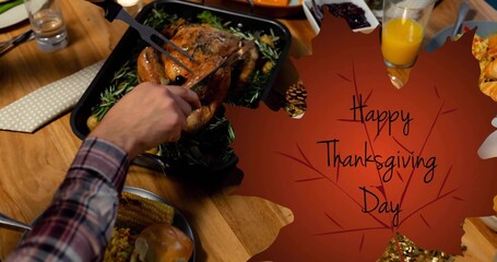 Carving roasted turkey with fork and knife at home table, plaid-sleeved arm, Thanksgiving placard