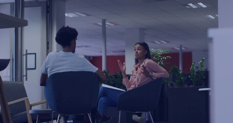 Explaining software engineer colleague describing Python evolution at office, showing code examples