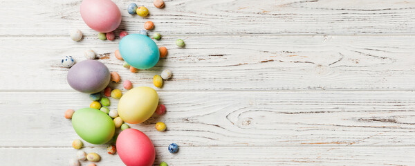 Obraz premium holiday preparation Multi colors Easter eggs on colored background . Pastel color Easter eggs. holiday concept with copy space