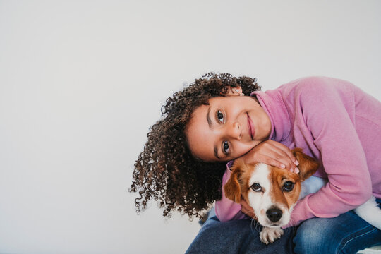 Portrait of smiling little girl and her dog