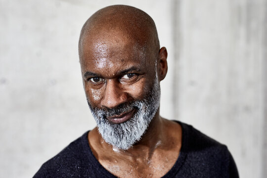 Portrait of smiling sweating mature man