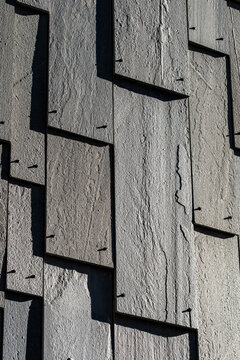 Abstract architecture facade built from rough concrete wall with gray texture pattern and simple design for modern material background