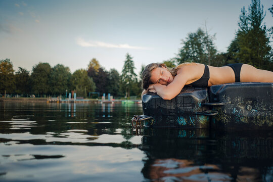 Young woman lying on bathing platform