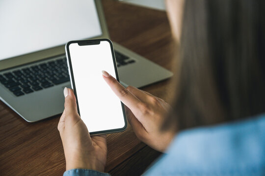 Young woman using smartphone at home