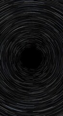 Obraz premium Long exposure image of circular star trails, forming a mesmerizing cosmic vortex. White light streaks spiral into a deep black void, depicting celestial rotation and space