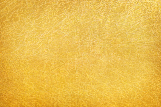 Shiny yellow leaf gold foil texture background