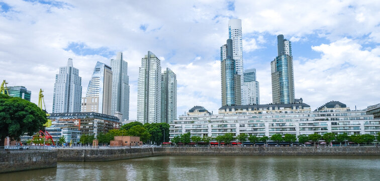 Modern skyscrapers and waterfront apartments line the docks of Puerto Madero in Buenos Aires