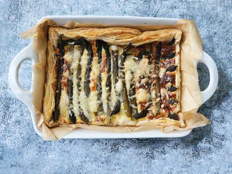 Traditional French tart with asparagus and cheese. Delicious tart for lunch