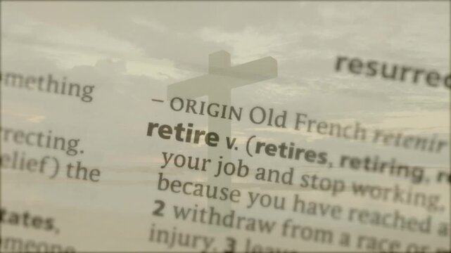 Focus shifting, dictionary page coming into clarity, translucent cross revealing retire definition
