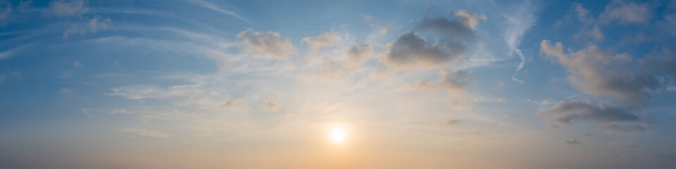 Fototapeta premium Peaceful evening panorama sky on golden hour over the horizon.