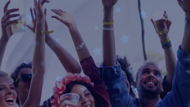 Festival group raising arms and toasting with cups after beat drop, celebrating under star overlay