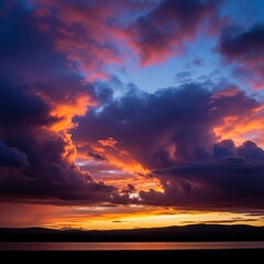 Dramatic cloud formations defining the distant weather horizon over a calm landscape, suggesting an impending change in atmospheric conditions, scenic, ominous, edge