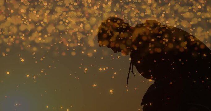 Man leaning forward in studio, bokeh entering frame causing deeper bow for art production