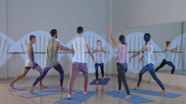 Yoga coach cueing and showing poses while class mirroring on mats for posture, mirror reflecting