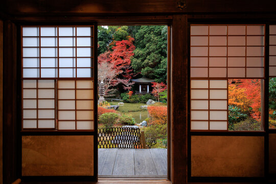 Traditional japanese garden with autumn foliage from temple