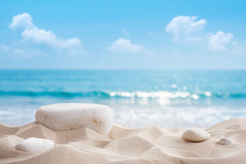 Obraz premium Natural stone as podium for product display on tropical sand beach with blurred blue summer sea wave and cloud sky background