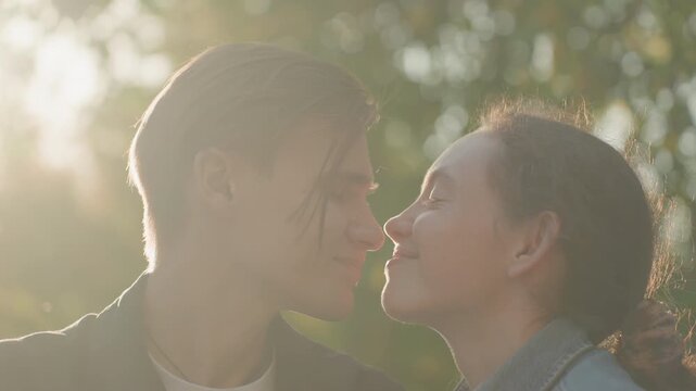 Couples pledge together. Romantic couples exchange vows outdoors. Bright park setting with lovers promises exchanged. Sunshine bathes pairs as they tenderly declare their love commitments