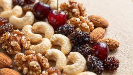 Fototapeta premium A variety of nuts, dried fruits, and candied pecans spread across a table