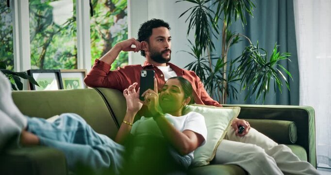 Happy, phone and couple on sofa for watching tv for bonding, connection and talking on weekend. Relax, home and man with woman on smartphone for entertainment, social media and relationship together