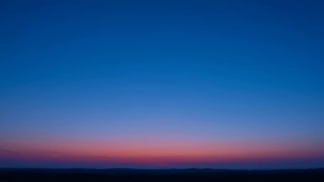 Serene evening landscape featuring a gradient of blue and pink hues in the sky