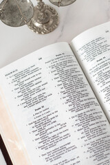 Biblical text of justice and God's righteous judgment in open holy bible book with balance scales. Christian biblical concept.