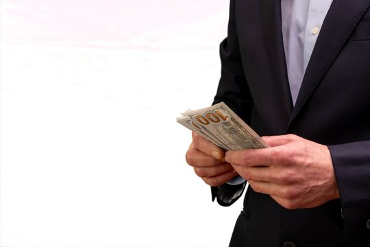 Man businessman holding dollars during economic crisis and financial problems.
