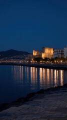 Naklejka premium Illuminated Waterfront at Night in Naples with Scenic Reflections and Castle View