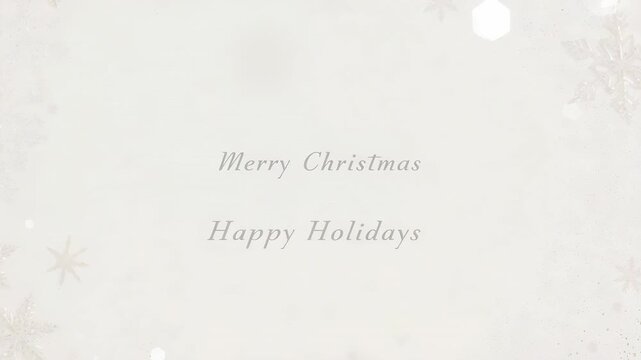 Animation starting, center greeting text pulsing with drifting bokeh, flake motifs for holiday card