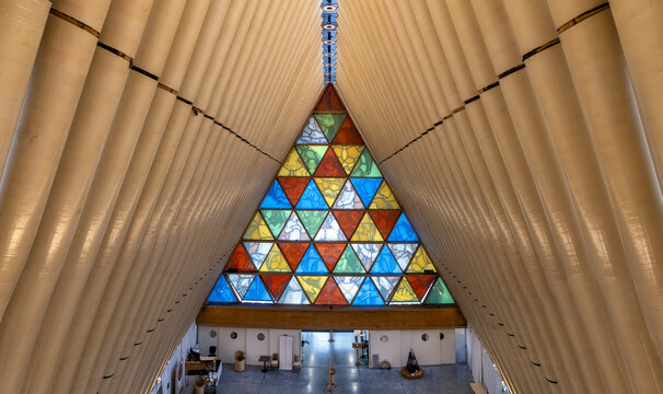 Christchurch, New Zealand - 13 February 2026: Aerial view of the Cardboard Cathedral's majestic interior, where light filters through stained glass, illuminating the unique architectural design.