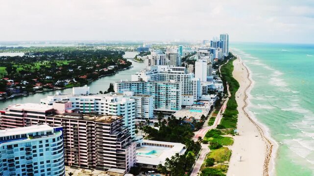 Aerial drone view of Miami beach skyline and turquoise Atlantic Ocean coastline with modern high rise buildings in sunny daylight &ndash; 18 June 2026 &ndash; vibrant coastal cityscape cinematic 4K.