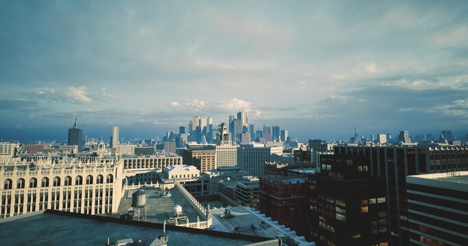 calm morning skyline above rooftop with distant skyscrapers under soft cloud cover, historic brick ledges and metal vents framing foreground, cool blue tones