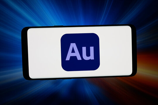 Stuttgart, Germany - 03-02-2026: In this photo illustration, the logo of digital audio software Adobe Audition is displayed on a smartphone in front of abstract background on computer screen.