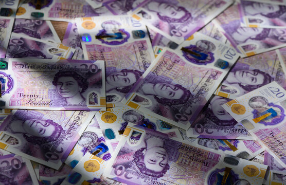 20 GBP Currency Notes Randomly Scattered on Table