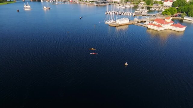 Panoramic aerial of tourists kayaking in front of Tammisaari, summer in Finland