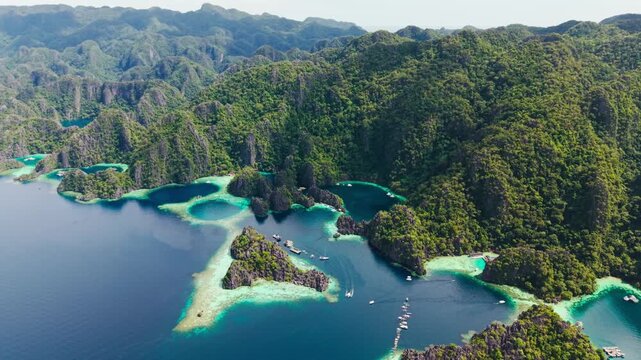 Turquoise lagoons and lush cliffs of Coron create a tropical paradise scene