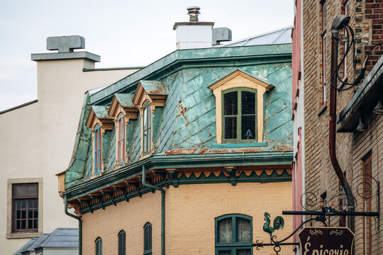 Quebec City, Canada - August 24, 2025: Historic building with green copper mansard roof and dormer windows in Old Quebec