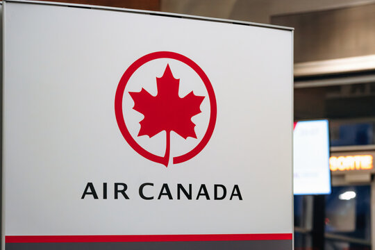 Montreal, Canada - August 25, 2025: Air Canada airline logo sign inside Montreal Trudeau International Airport terminal