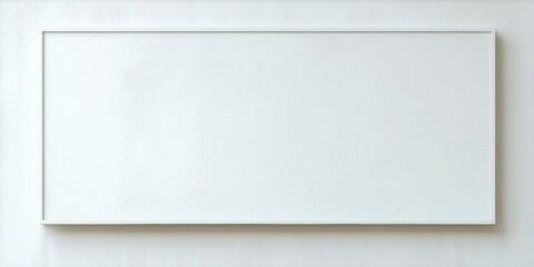 Obraz premium Rectangular white frame hangs centered on light wall. Minimalist design, clean lines, simple presentation. Blank canvas offers potential.