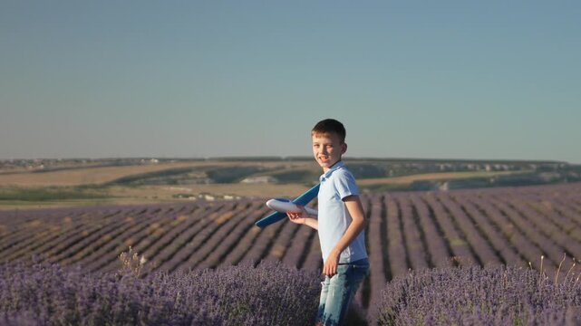Boy airplane lavender field walking dreams of flying in summer sun happy childhood freedom