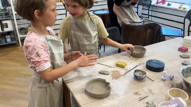 children make dishes out of clay