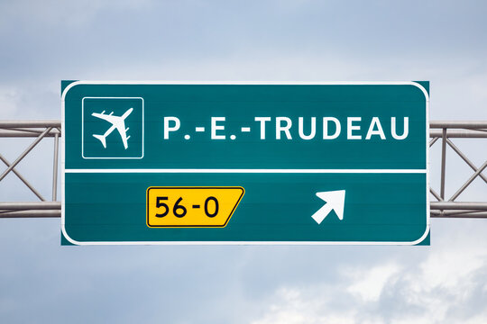 Montreal, Canada - August 24, 2025: Highway sign indicating exit to Pierre Elliott Trudeau International Airport near Montreal