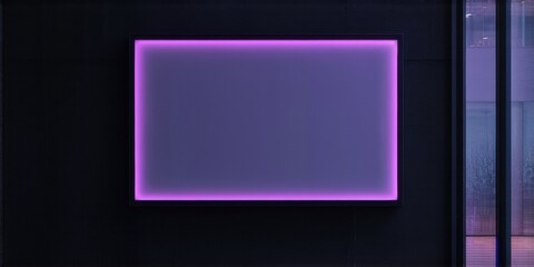 Fototapeta premium Rectangular screen glows purple against dark wall. Minimalist design, modern aesthetic, ambient lighting creates dramatic effect. Interior space visible beyond.