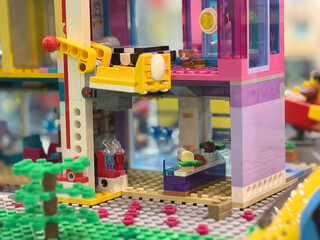 Fototapeta premium Colorful lego playset storefront with crane