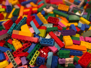 Fototapeta premium Colorful pile of interlocking building bricks