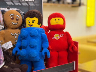 Naklejka premium Plush lego-style minifigure dolls on display