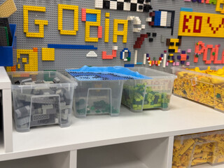Naklejka premium Organized lego storage bins on shelf