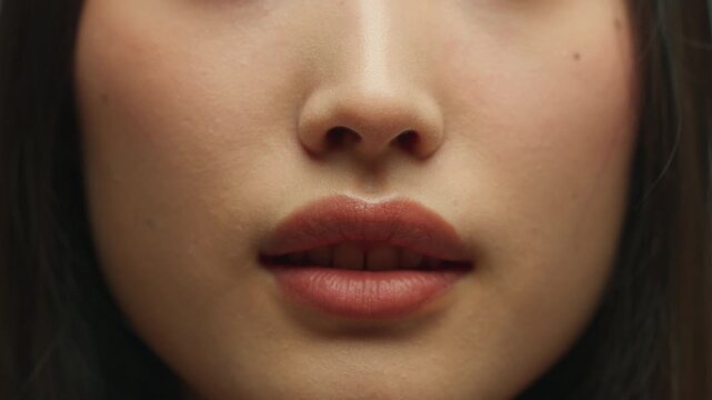 Closeup woman open mouth female plump lips natural beauty Asian girl unrecognizable Korean lady model face skin lip balm lipstick filler surgery injection procedure cosmetics teeth health cute smiling