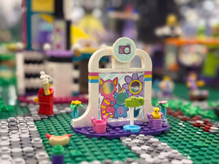 Naklejka premium Colorful lego stage with props and minifigures