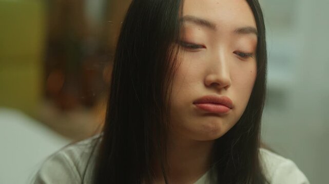 Asian woman at home feeling sad sleepy insomnia problem tired worry mental suffer Korean girl upset stress ill sick headache migraine Chinese Japanese female thoughtful drama thinking breakup abortion