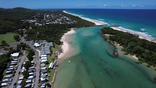 Holiday Park Along Mooball Creek In Summer In Pottsville, New South Wales, Australia. - aerial shot